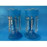 A pair of blue glass Victorian lustres. 30 cm high