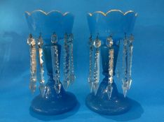 A pair of blue glass Victorian lustres. 30 cm high