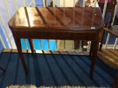 A 19th century mahogany fold over tea table