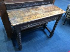 A carved oak bobbin turned side table with single drawer, 90cm wide