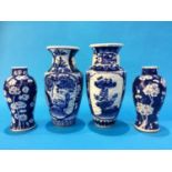 A pair of Chinese blue and white vases decorated with prunus leaves, marks in underglaze blue, and