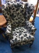 A Parker Knoll wing armchair