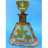 A Bohemian amber glass triangular shaped decanter, with etched decoration of a deer running