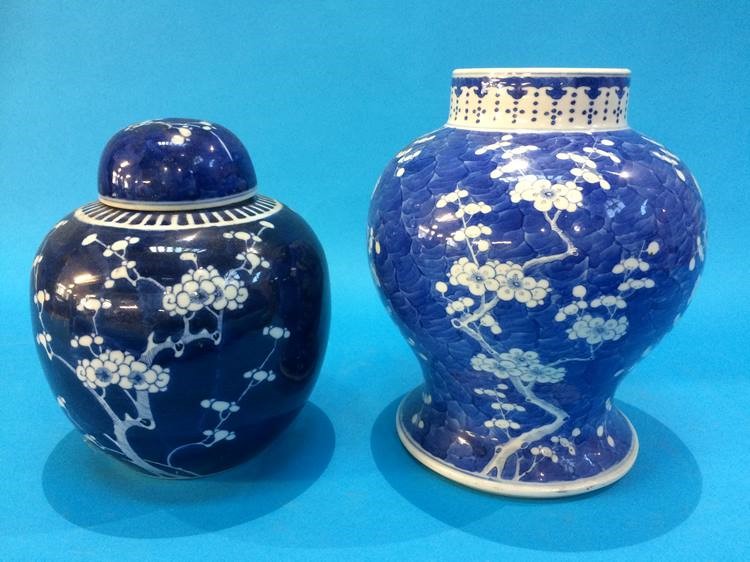 A Chinese Ginger jar and cover and a larger Chinese vase. 20 cm and 24 cm high