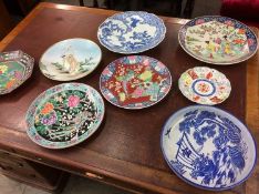 A collection of 8 Imari wall plates