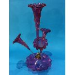 A Victorian Cranberry glass epergne with four glass trumpets