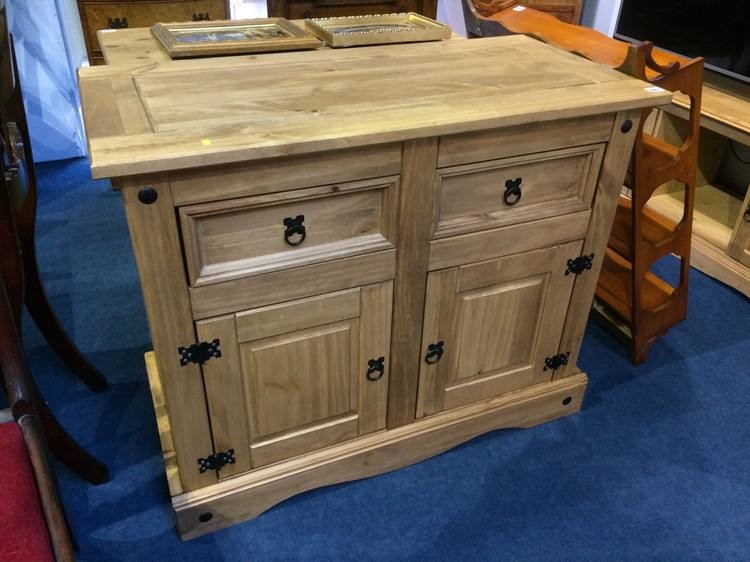 A pine cabinet with two drawers and two cupboard doors, 106cm wide