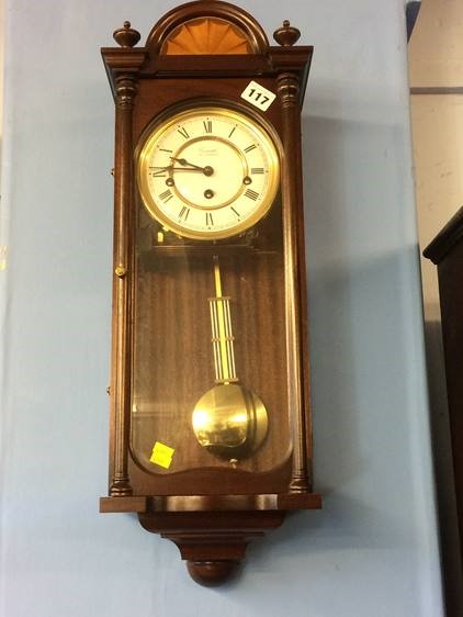 A reproduction mahogany Comitti of London wall clock