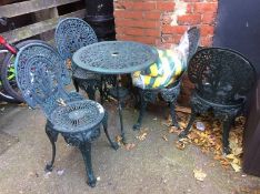 A garden table and four chairs