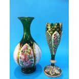 A Bohemian green glass spill vase with enamelled panels decorated with flowers, 23 cm high and