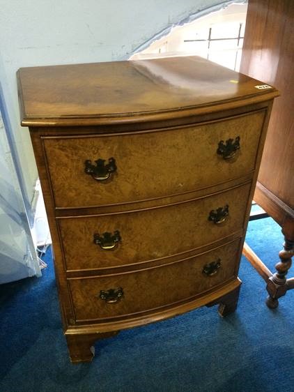 A small walnut bow front chest of drawers, 54cm wide