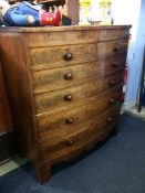 A 19th century mahogany bow front chest of drawers with two short and four long drawers, supported