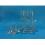 A set of six Victorian etched glasses, dated 1889 and a pair of glass shoes etc.