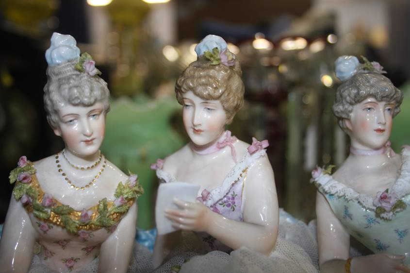 A late 19th century Continental porcelain group of three young Ladies seated on a bench, under a - Image 5 of 8