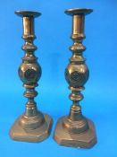 A pair of brass candlesticks