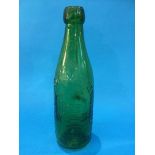A green glass bottle 'Darlington Bottling and Mineral Water Co. Ltd'