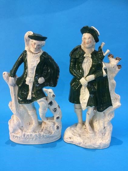 A pair of Staffordshire figures of Highlanders