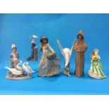 Six Lladro figures to include; a Monk, two girls, Dove etc.