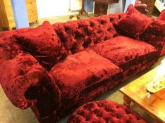 A Delcor crushed velvet purple Chesterfield settee and matching circular footstool