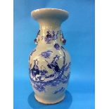 A Chinese vase on a pale sage ground decorated with figures and having lion handles. 42 cm high