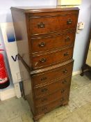 Walnut bow front chest of drawers with seven drawers, 49cm wide