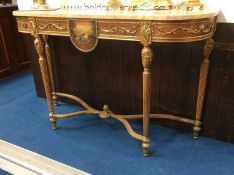 A Louis XV style side table, with marble top, gilt metal mounts and reeded and fluted tapering legs,