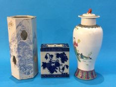 A Chinese blue and white octagonal vase decorated with landscapes, a Chinese blue and white flower