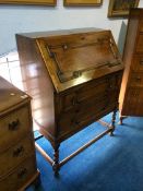 An oak barley twist bureau