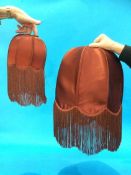 Two Burnt Crimson 'Biba' lamp shades with tassels (not labelled)