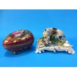 A Continental porcelain 'Abundantia' egg box with gilt metal mounts and ball feet, and a 19th