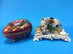 A Continental porcelain 'Abundantia' egg box with gilt metal mounts and ball feet, and a 19th