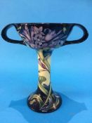 A modern Moorcroft two handled pedestal cup. 18.5cm high