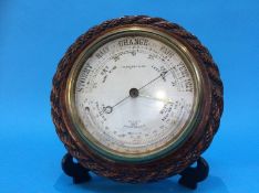 An oak rope twist barometer by Blakey and Co.