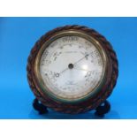 An oak rope twist barometer by Blakey and Co.