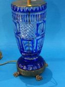 A large glass and blue flushed cut glass table lamp