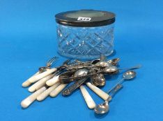 A cut glass Biscuit barrel containing various silver spoons etc.