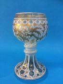 A Bohemian glass goblet of clear glass and white flashing, with gilt decoration. 23.5 cm high