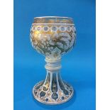 A Bohemian glass goblet of clear glass and white flashing, with gilt decoration. 23.5 cm high