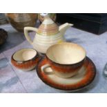 Clarice Cliff tea pot, cup and saucer and sugar bowl