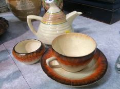 Clarice Cliff tea pot, cup and saucer and sugar bowl
