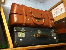 Suitcases, mirror and an oil on board