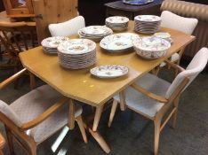 A pale oak Ercol style refectory table and four chairs