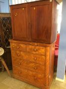 A chest of drawers and a mahogany cabinet