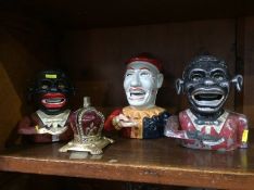 Four various cast money boxes