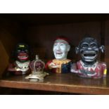 Four various cast money boxes