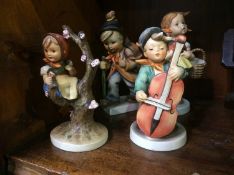 Four Hummel figures