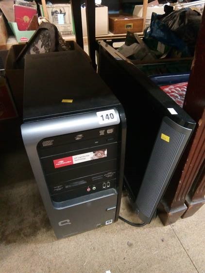 A Compaq computer tower and monitor
