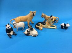 Two Beswick lions, two pandas, sheep etc.