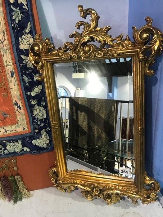 An ornate gilt mirror