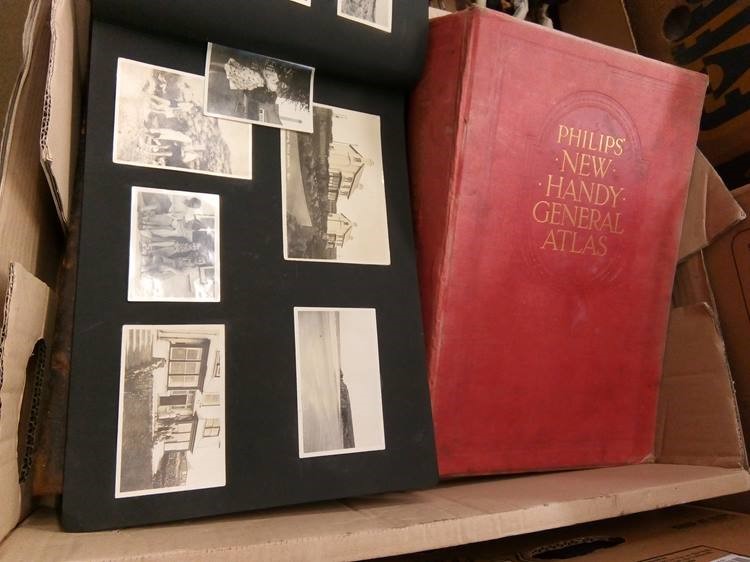 A bible, atlas and photograph album